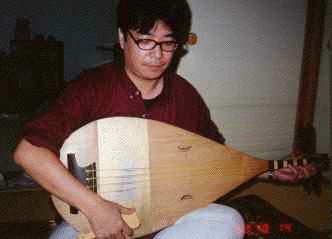 Nakata-san strums the biwa